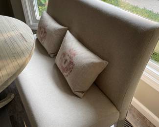 Linen dining bench with lumbar pillows