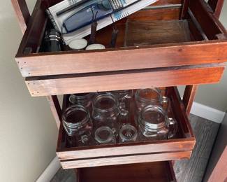 Three tier storage rack shown with ball glassware and lighters 