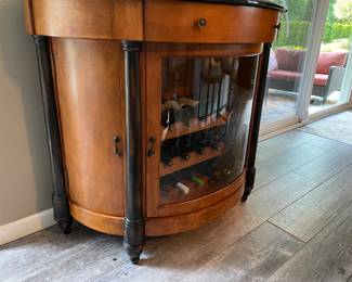 Demi-lune wine cabinet with black granite top (cabinet has center drawer, lower cabinet with wine rack, and side cabinets) - wine NOT included 