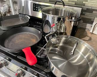 Lodge cast iron skillet with silicone handler; stainless large skillets, stock pot, and panini pan and more!