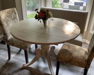 single pedestal table with drop-leaf sides and 2 side chairs 