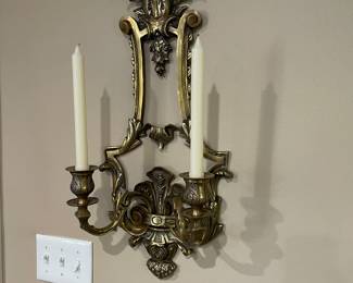 brass wall sconce with 2 candles