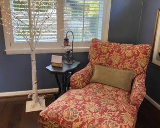 Settee lounger, black side table with accent lamp, and holiday birch tree (lit).