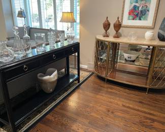 Consoles - 3-drawer with lower tier and demilune with glass shelves, lit, and side cabinets; collection crystal and glassware by:  Yeoward, Tiffany & Co., Baccarat, and Simon Pierce, Waterford, and Wedgwood bowl and canisters, Barbara Wood - "The Last Performance" artwork