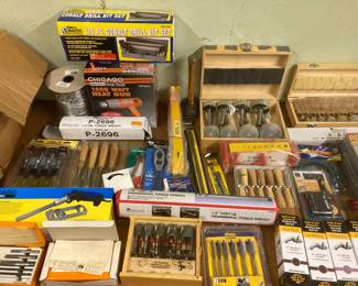Chisels and unopened drill bit sets