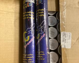 Cases of unopened neon glow in the dark bracelets