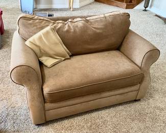 Light tan love seat/twin bed combo.