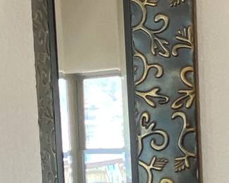 Elongated or rectangle beveled glass wall mirror.