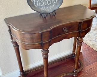 Mid size wood Foyer table with drawer.
