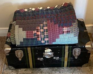 Old storage trunk and quilt, sold separately.