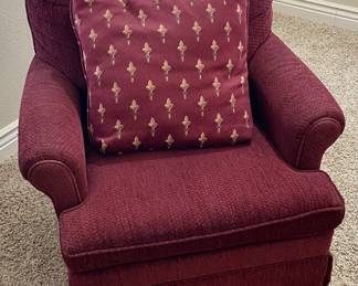 One of 2 Maroon fabric Vintage Swivel chairs.