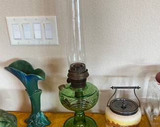 Excellent Antique Aladdin Green Washington Drape Oil Lamp with shade shown next to Blue Teal and Green Ornate Royal Haeger Vase.