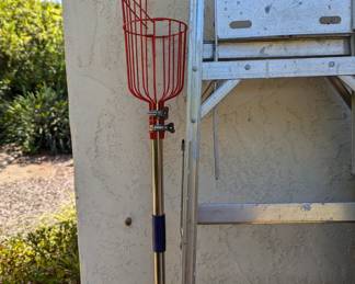 A ladder and a fruit picker ...I guess you could pick on or the other !