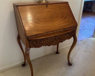 Queen Anne secretary desk with decorative carving 