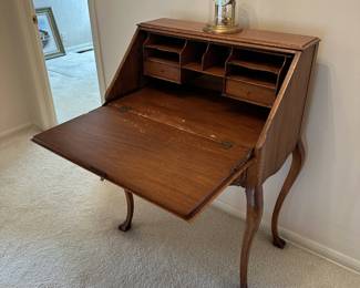 Queen Anne secretary desk with decorative carving 