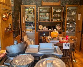 This kitchen is packed.  Cake molds, Bundt pans, baking pans, holiday, Tupperware
