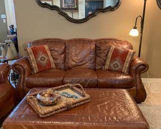 leather couch with nailhead trim and large ottoman