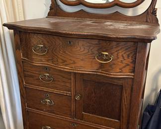 Tall antique dresser with mirror