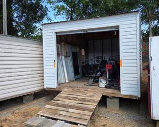 12' x 16' w/ double doors, roll up door & windows, pre-wired w/ light & outlet