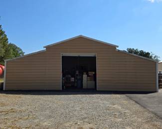 45'x20' metal work/storage building w/ roll up door & side entry door. $4,800 FIRM.