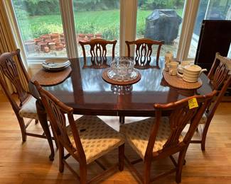 Dining table (sold separately from chairs), comes with protection covers and 2 leaves.  6 dining room chairs (sold as a set).