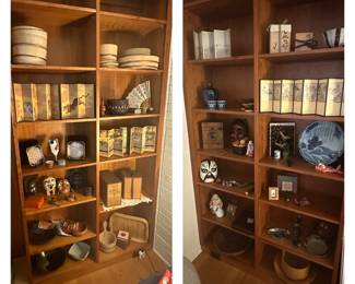 Shelves full of Asian decor.  Masks, plates, screens, pottery, etc.