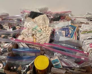 Notions galore !!! Hundreds of spools of thread, thousands of buttons, zippers, antique lace and ribbon , fabric, patterns, beads , jewelry making supplies, rubber stamps and so much more !!!