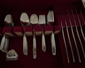 Several sets of flatware.