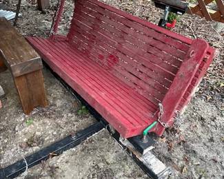 Old wooden porch swing, which there are 3