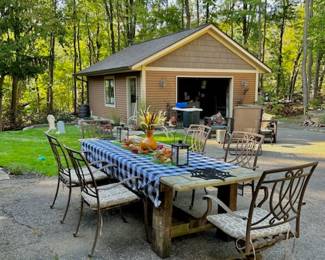 Stunning and heavy, handmade farm table made of solid barn wood. One of a kind. Chairs sold separately. Tablecloth and accessories also available (photo taken before sale set-up).