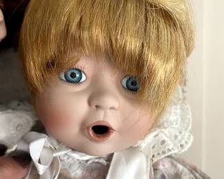 A few porcelain collectible dolls