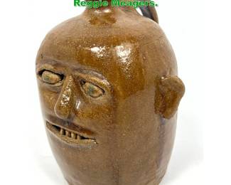 Lot 1670 Folk Art Stoneware Face Jug. Reggie Meagers. 