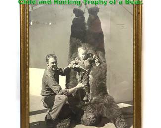 Lot 1648 Vintage Photograph of Man with Child and Hunting Trophy of a Bear.