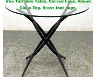Lot 1411 Modernist Designer Matte Black Iron Tall Side Table. Curved Legs. Round Glass Top. Brass foot caps. 