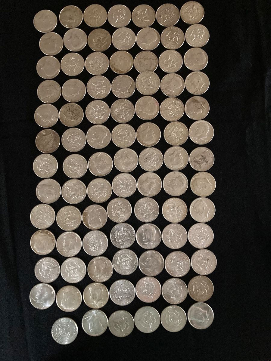 90 1964 Kennedy 1/2 dollars. These were purchased new in rolls, then opened and kept in a butter dish. Never circulated but still touched