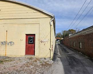 Entrance to the sale at he back of the building