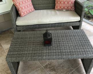 RATTAN LOVESEAT AND OTTOMAN