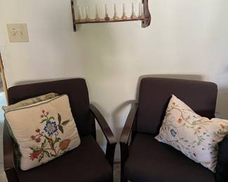 occasional chairs, throw pillows, shelf, matchstick figures