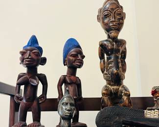 Left: A pair of Nigerian Yurba fertility figures. Right: African Baule male ancestor. 