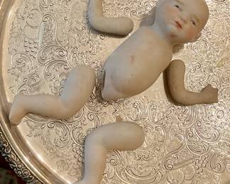 Antique porcelain baby doll needs to be restrung.