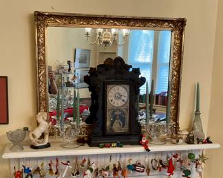 Large gold mirror,  clock, vintage Christmas ornaments, toy punch bowl set, what nots, and candle holder
