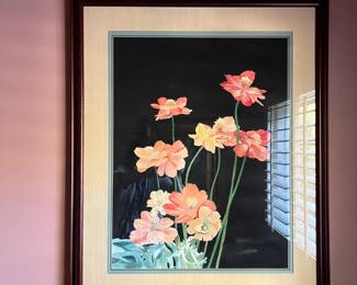 Another framed art is hanging on the wall.