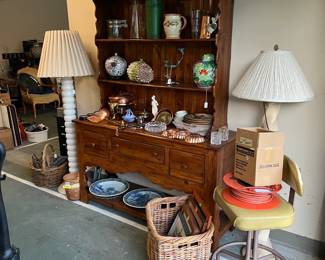 Not all the furniture could fit in the house.  This buffet cabinet is in excellent condition.  Don't overlook the tall lamps or the basket of framed art, and the items on the cabinet.
