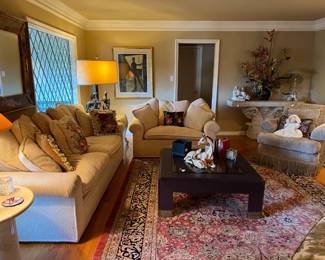 This is an overview of the room, with the sofa and oversized chair, the horse lamp in the back corner, and more.