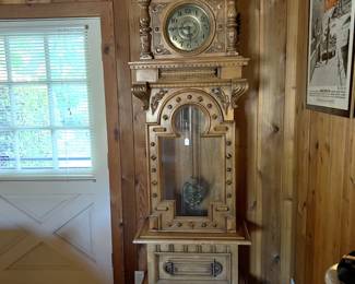 This ornate grandfather clock is definitely worth a look.  It chimes every quarter of the hour.