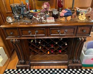 This ornate side table also has space for several bottles of wine.