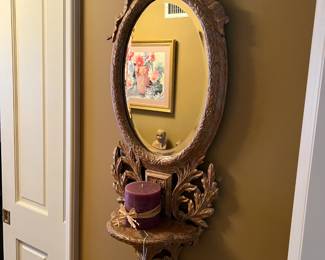 This hallway mirror has a small shelf, just big enough for a candle.
