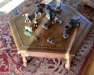 Hexagonal coffee tables are all the rage.  Get this one and you'll be all set.  The rottweiler statues are also cute.