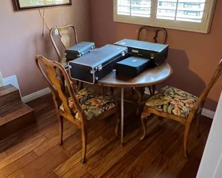 These are the cases for the saxophone, trumpet, and both clarinets.  But the matching chairs and small round table are here as well.  Don't forget those!