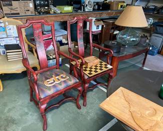 But these are a pair of matching dining chairs, plus a chess/checkers board, another lamp, more books, and a glass coffee table.